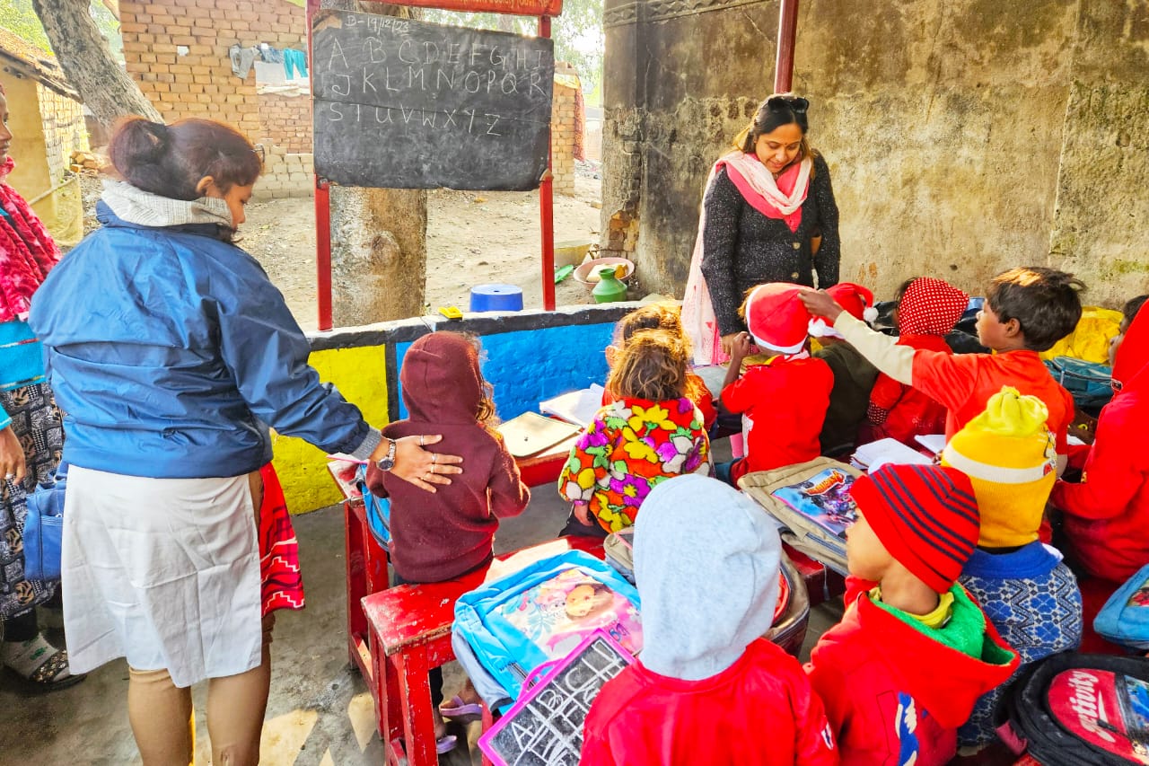 Teacher at blackboard with students
